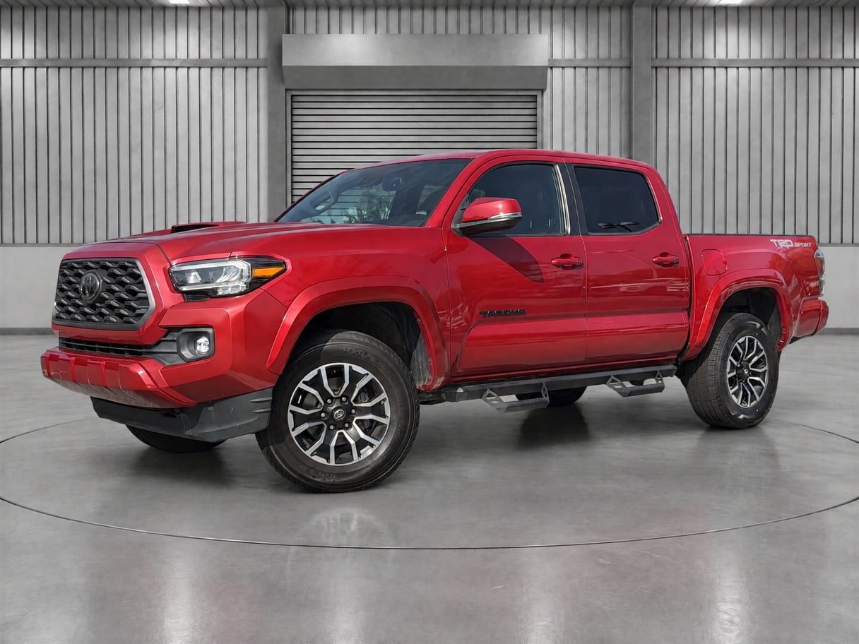 The same Tacoma in a warehouse bay with a roller door behind it.